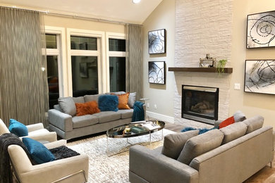 Trendy open concept vinyl floor living room photo in Calgary with a standard fireplace and a tile fireplace