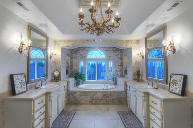 This is an example of a traditional bathroom in Seattle with distressed cabinets and porcelain floors.