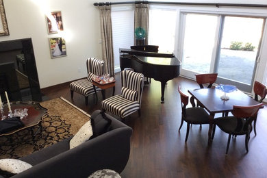 Mid-sized eclectic dark wood floor living room photo in Detroit with a music area, beige walls, a standard fireplace and a tile fireplace