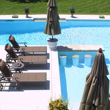 L shaped pool with bar stools