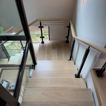 Project #136 | Modern Floating Staircase Encircling Glass Elevator