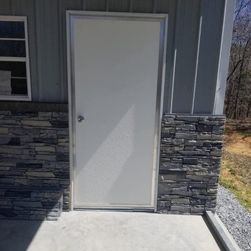 Northern Slate Stacked Stone Wainscoting on a Metal Building