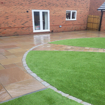 Raj Green Sandstone Patio and Artificial Grass