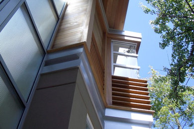 Large contemporary gray two-story wood exterior home idea in San Diego