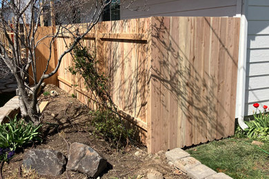 Inspiration for a wood fence landscaping in Boise.