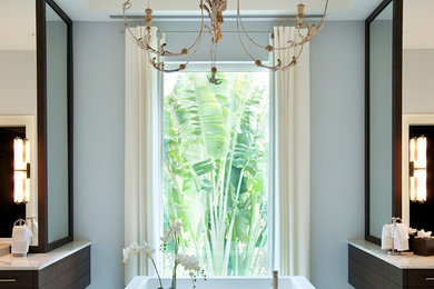 Bathroom - large contemporary master marble floor bathroom idea in Miami with flat-panel cabinets, dark wood cabinets, blue walls and marble countertops