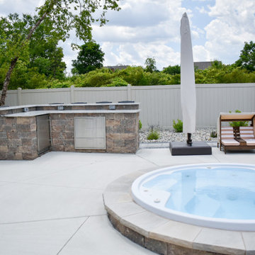 Outdoor Kitchen With Bar Seating + Landscaping