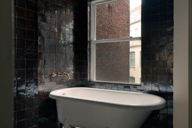 Example of a large trendy master brown tile and porcelain tile porcelain tile, beige floor and double-sink bathroom design in DC Metro with brown cabinets, a one-piece toilet, beige walls, a wall-mount sink, granite countertops, beige countertops and a built-in vanity