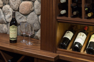 Wine cellar - traditional ceramic tile wine cellar idea in Boston