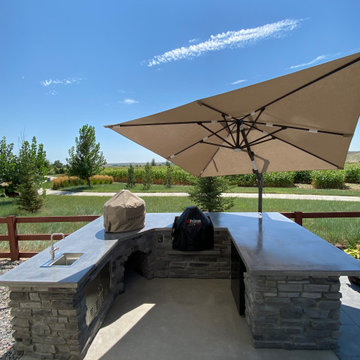 Rustic Reverie: Custom Concrete and Stone Unite in Your Outdoor Culinary Haven