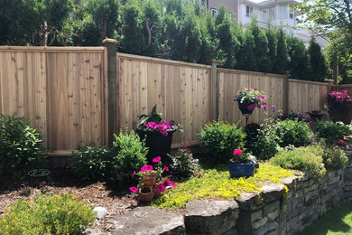 Photo of a mid-sized backyard landscaping in Vancouver for spring.