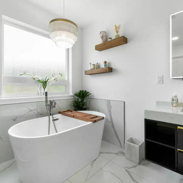 Finished Puyallup bathroom after a water-damage rebuild, showing the freestandin