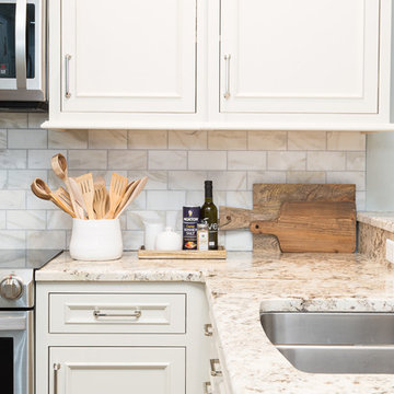 All White Cottage Style Kitchen with Stacked Cabinetry
