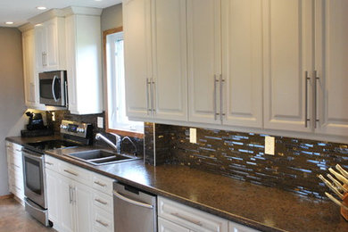 Inspiration for a large transitional single-wall ceramic tile and brown floor eat-in kitchen remodel in Calgary with a double-bowl sink, raised-panel cabinets, white cabinets, granite countertops, multicolored backsplash, matchstick tile backsplash, stainless steel appliances, no island and brown countertops
