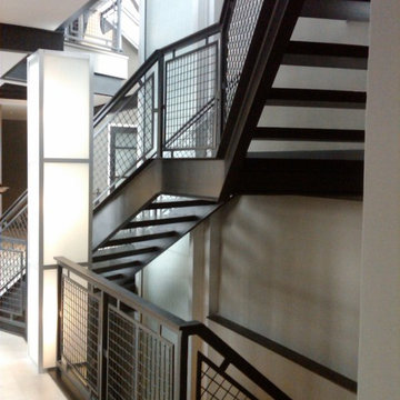 Stair Case With Wood Treads and Metal Railings