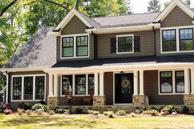 Inspiration for a brown concrete fiberboard house exterior remodel in Other with a shingle roof