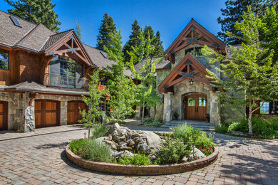 Inspiration for a large rustic brown two-story mixed siding gable roof remodel in Sacramento