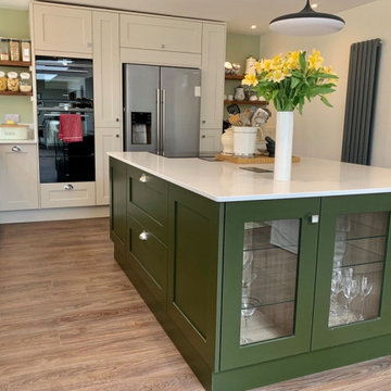 Painted shaker kitchen in off white and mid tone forest green