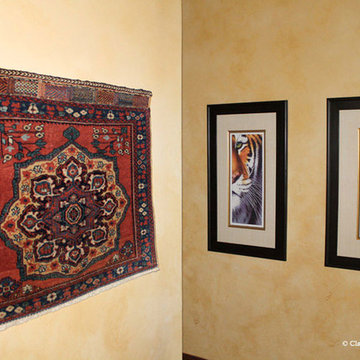 Antique Rugs on Walls with Paintings and Photographs