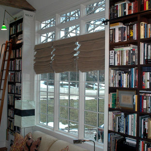 Victorian home office and library in Boston with a reading nook and white walls.
