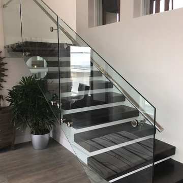 Floating iron stair with glass railings