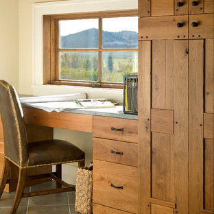 Inspiration for a large traditional study room in Other with beige walls, ceramic floors and a built-in desk.