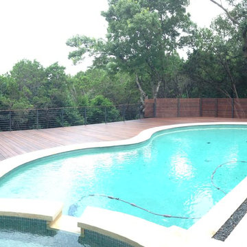Modern ipe deck, railing and screen around existing pool