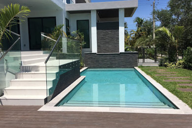 Pool - mid-sized modern pool idea in Miami