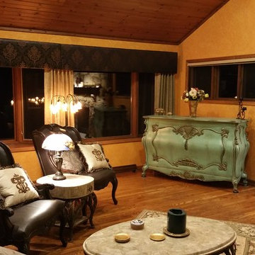 Elegant custom flat screen TV lift cabinet placed next to fire place