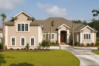 Island style beige two-story exterior home photo in Atlanta