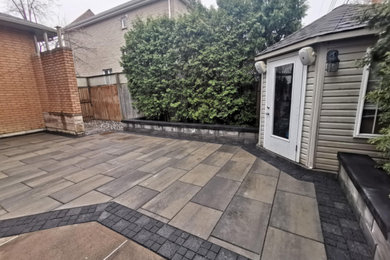 Minimalist backyard patio photo in Montreal with no cover