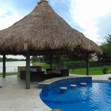 Tiki Hut with Bar Area for Custom Pool with Rock Waterfall and Wet Edge Spa in D