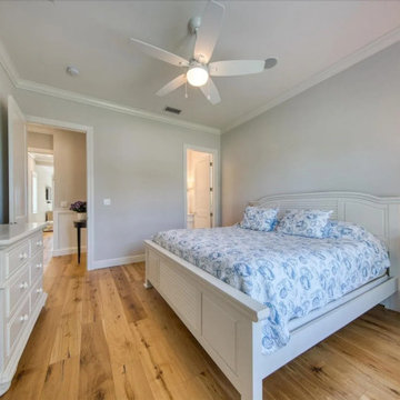 Nautical-Inspired Girl’s Bedroom with White Coastal Charm and Light Hardwood Acc