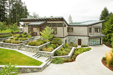 Example of a trendy multicolored two-story mixed siding exterior home design in Vancouver