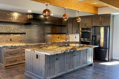 Mid-sized eclectic l-shaped vinyl floor, brown floor and exposed beam eat-in kitchen photo in Phoenix with a farmhouse sink, shaker cabinets, dark wood cabinets, granite countertops, metallic backsplash, porcelain backsplash, stainless steel appliances, an island and multicolored countertops