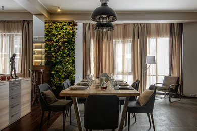 Contemporary open plan dining in Moscow with beige walls.