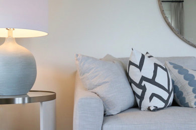 Inspiration for a small coastal gray floor living room remodel in Boston with white walls and a wall-mounted tv