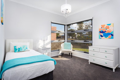 Inspiration for a transitional bedroom in Brisbane with grey walls, carpet and black floor.