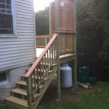 Presure treated deck with cedar cap rail and, privacy lattice