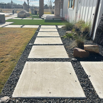 Stepping Stone Path Beside House With Gravel and Turf