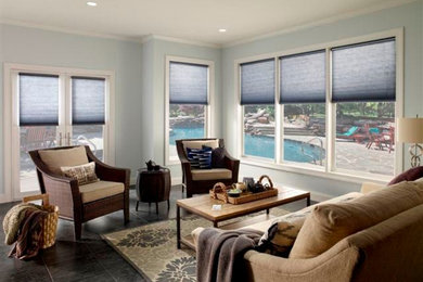 Mid-sized transitional formal and open concept ceramic tile and gray floor living room photo in Orange County with gray walls and no tv