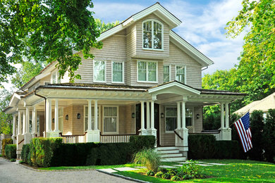 Inspiration for a timeless beige three-story wood exterior home remodel in New York