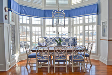 Kitchen/dining room combo - large contemporary medium tone wood floor and brown floor kitchen/dining room combo idea in Bridgeport with white walls and no fireplace