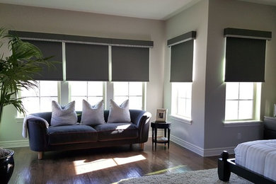 Example of a mid-sized classic master dark wood floor and beige floor bedroom design in Phoenix with beige walls and no fireplace