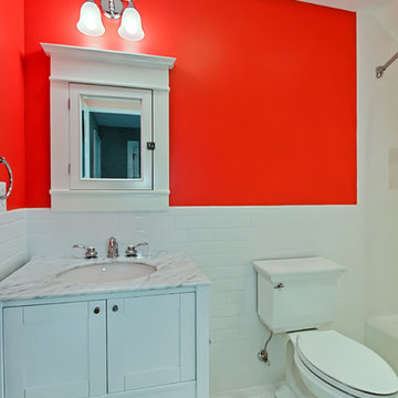 Orange Bath with white vanity