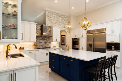 Large trendy galley marble floor and white floor eat-in kitchen photo in DC Metro with shaker cabinets, white cabinets, quartzite countertops, stainless steel appliances, an island and white countertops