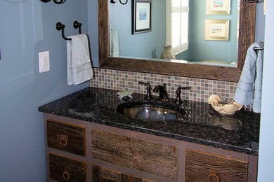 Bathroom - rustic master beige tile, brown tile, gray tile, white tile and ceramic tile porcelain tile bathroom idea in Minneapolis with furniture-like cabinets, distressed cabinets, blue walls, an undermount sink and granite countertops