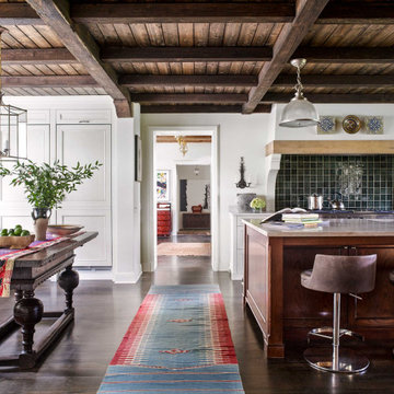 Rustic Tudor Estate Kitchen: Timber Beams, Custom Cabinets, and Vibrant Global T