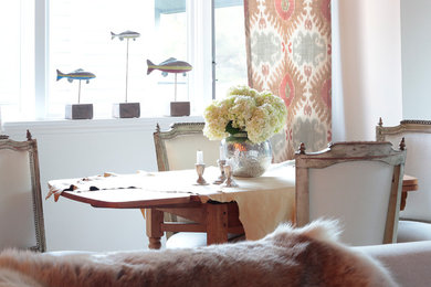 Example of a classic dining room design in Denver with white walls and no fireplace