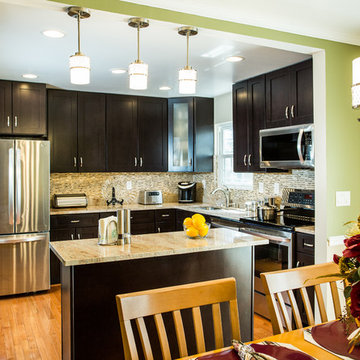 Espresso Kitchen Remodel with Granite Island and Stainless Steel Appliances